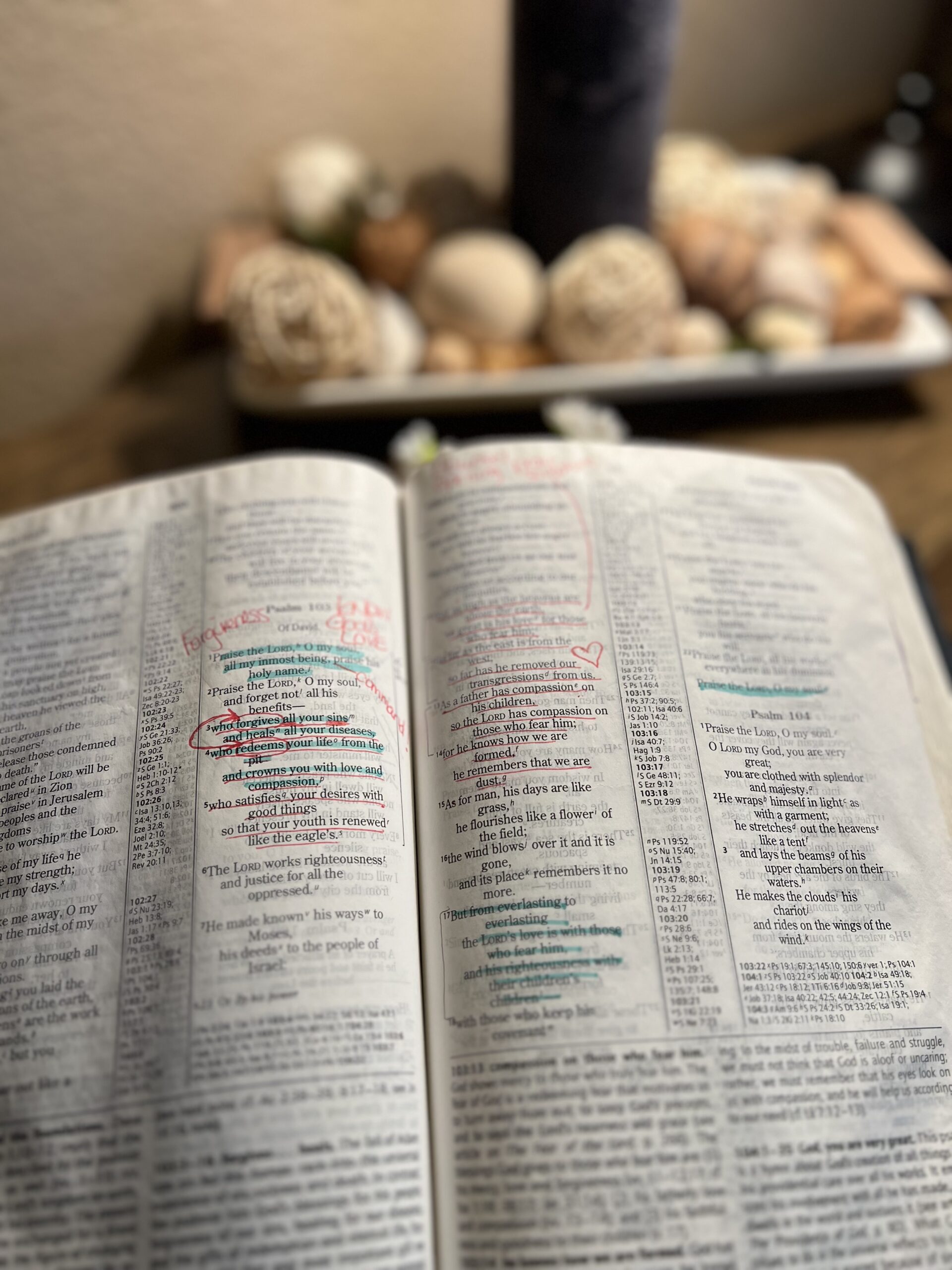 Open Bible with handwritten notes and highlighted promises on a wooden table.